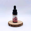 Huile CBD 5% pour animaux 10ml par NOVALOA, flacon avec pipette sur support en bois, bien-être naturel pour chiens, chats et chevaux.