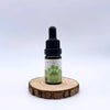 Huile CBD 5% pour animaux 10ml par NOVALOA, flacon avec pipette sur support en bois, idéale pour le bien-être des chiens, chats et chevaux.