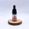 Huile CBD 5% pour animaux 10ml par NOVALOA, flacon avec pipette sur support en bois, bien-être naturel pour chiens, chats et chevaux.