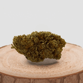 Fleur de CBD LEMON MERINGUE sur socle en bois